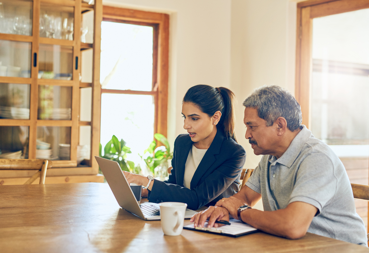 Man and Woman Looking at laptop