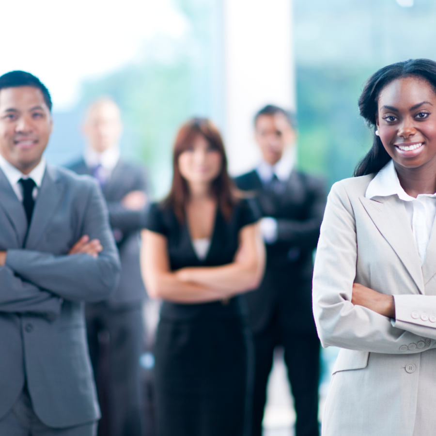 Business people standing with arms folded Business people standing with arms folded
