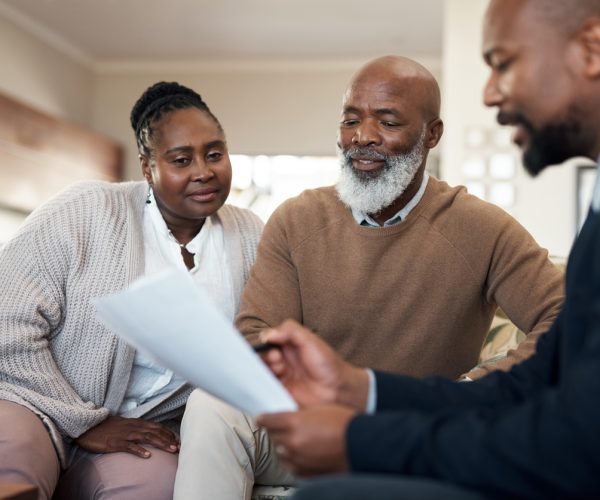 Mature, senior and married couple and a finance manager looking at retirement, savings and investment paper work. Man and woman planning a budget for their future with an accountant, banker or broker Mature, senior and married couple and a finance manager looking at retirement, savings and investment paper work. Man and woman planning a budget for their future with an accountant, banker or broker